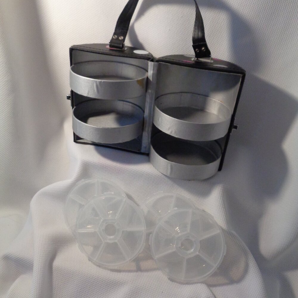 Travel case with 4 trays and removable inserts.  Earrings or medications